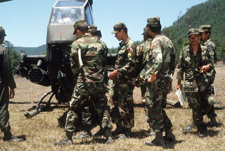 Image: AH-1F being armed with missiles and 20mm ammunition