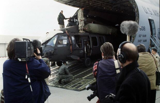 Image: Airmen unload an Army Blackhawk helicopter from a C-5 Galaxy