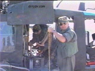 Image: CW4 Bruce Bridge loading minigun ammo