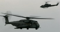 Image: A CH-53E Super Stallion and a AH-1W Super Cobra helicopter